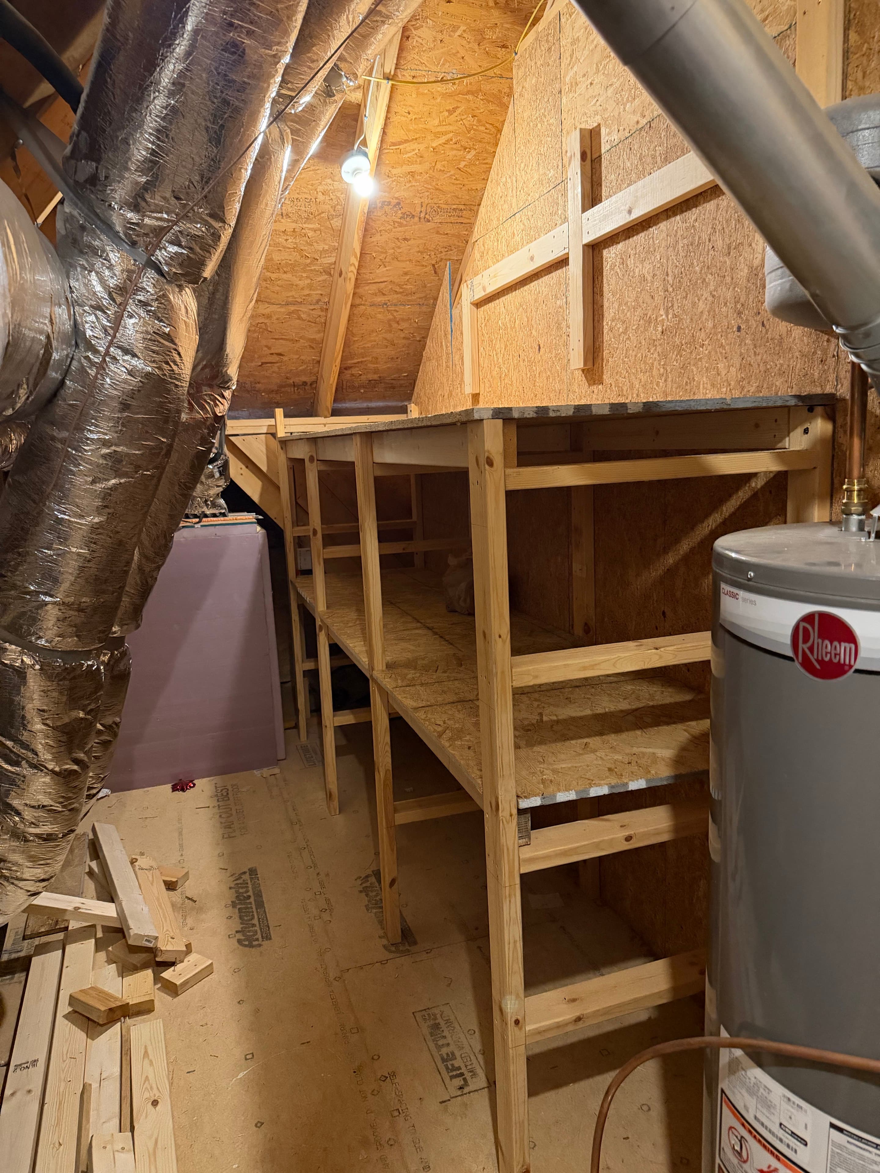 Attic storage area with empty shelves and floor space visible