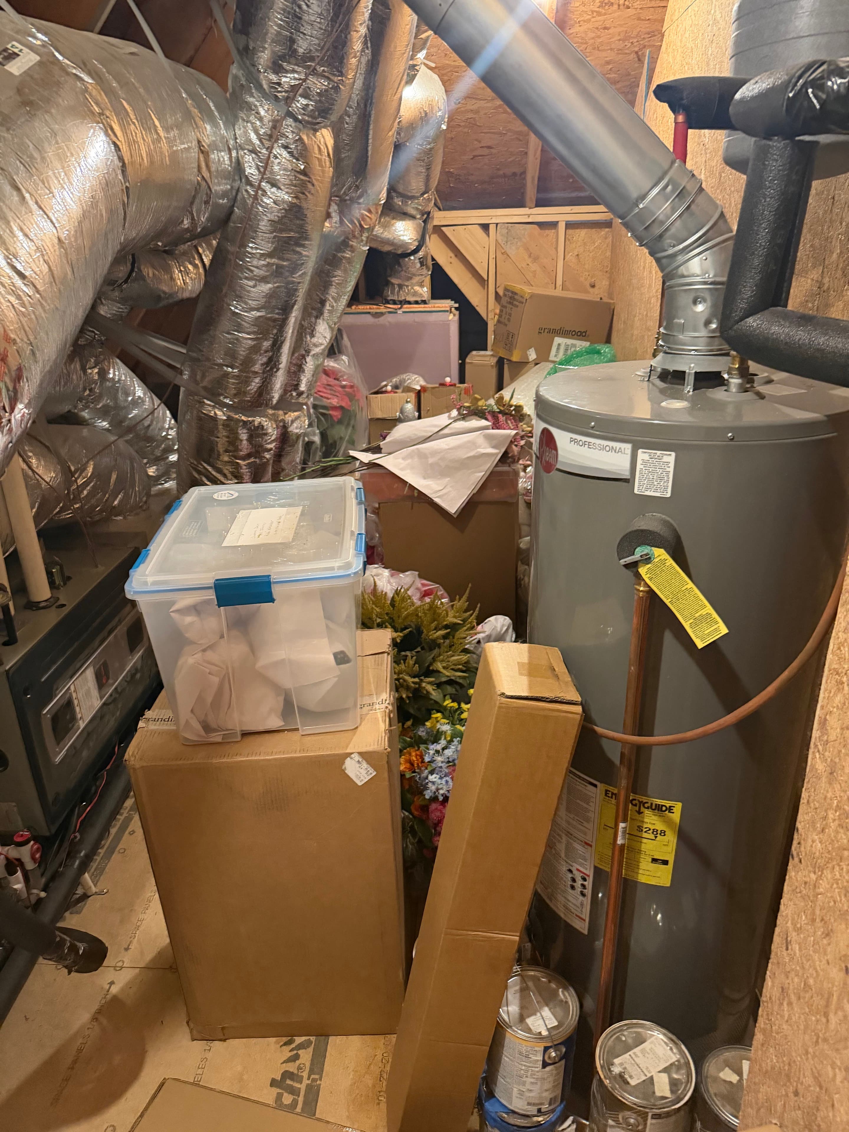 Boxes and stored household items in an attic storage area